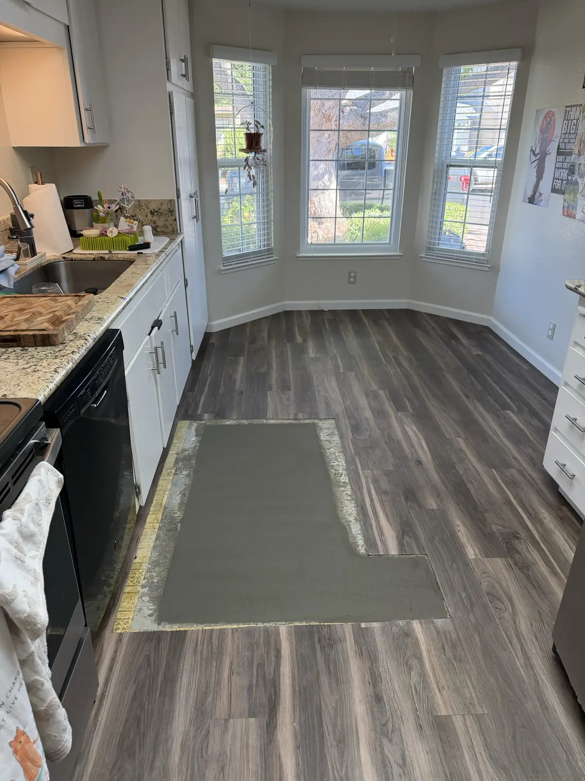 Pleasanton kitchen with the concrete slab patched back after the drain line replacement and the surrounding floor left intact
